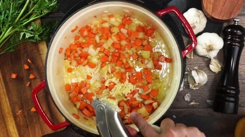 Adding Garlic to Sauteed Carrots and Onions