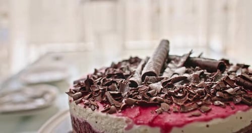 Delicious Chocolate Cake with Red Frosting on Plate