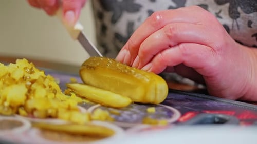 Slicing Pickles with a Sharp Knife in Kitchen