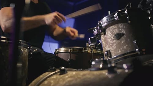 a Young Attractive Guy Plays a Drum Kit