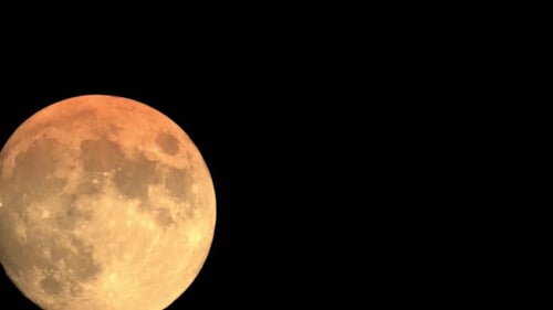 The Moon Moves Through Space in Darkness