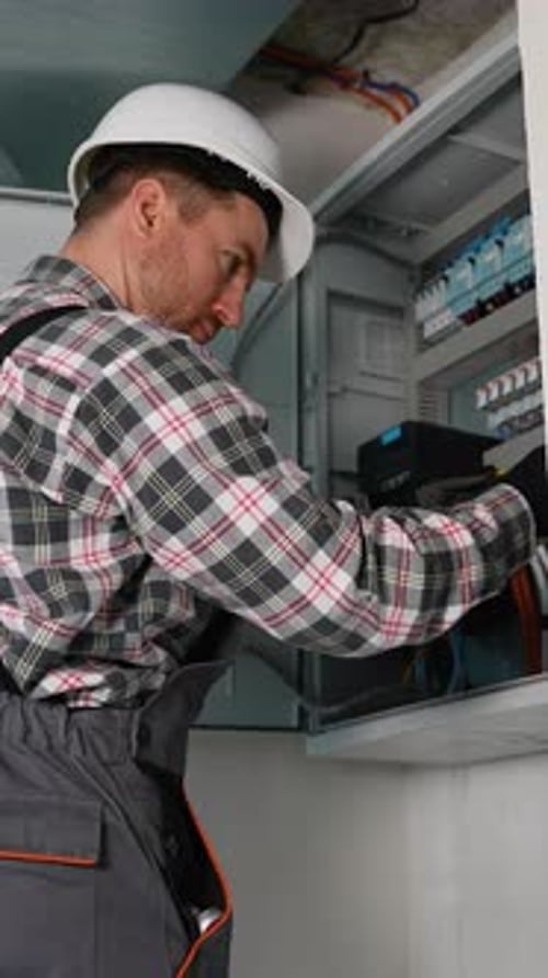 Electrician Working on Electrical System Wiring