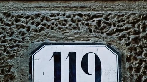Number 119 (one hundred and nine) Affixed to a Building