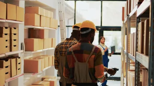 Men Scanning Inventory in Warehouse Setting