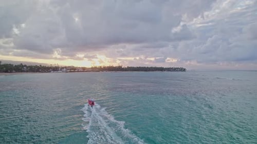 Aerial Tracking of Excursion Boat at Sunset in Las Terrenas, Dominican Republic