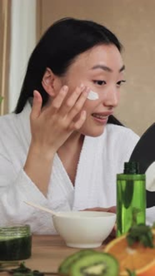 Woman Applying Eye Cream