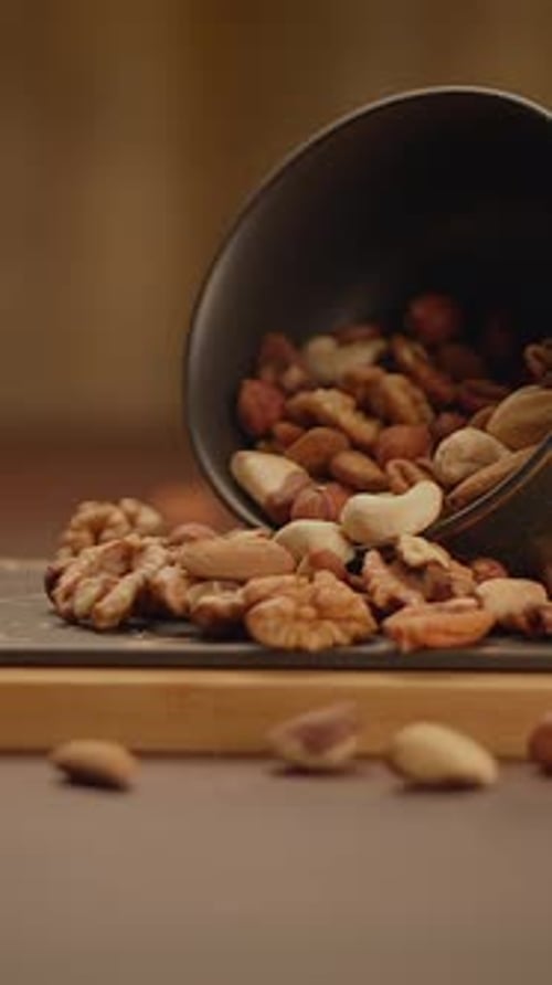 Variety of Nuts Spilling from a Bowl