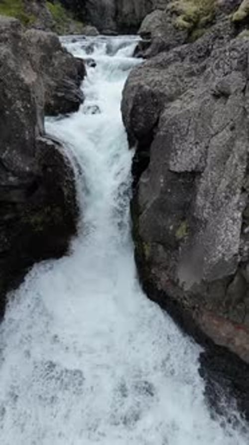 Aerial view of a waterfall and river, Iceland.