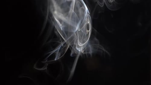 Dynamic Rising White Smoke Plumes on Black Background