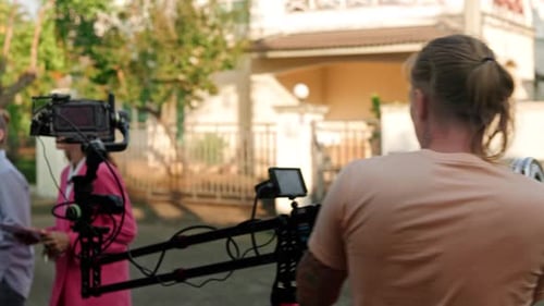 Film Crew Shoots Scene on Suburban Street