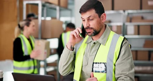 Laptop, logistics and phone call with man in warehouse for delivery, distribution or shipping