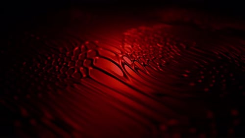 Dark fluid patterns background with bloody red surface and morphing liquid organic structures