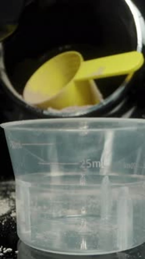 Liquid Being Poured into Measuring Cup