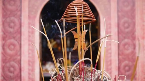 Burning Incense Sticks In A Buddhist Temple At Tam Coc, Vietnam. - Orbiting Shot