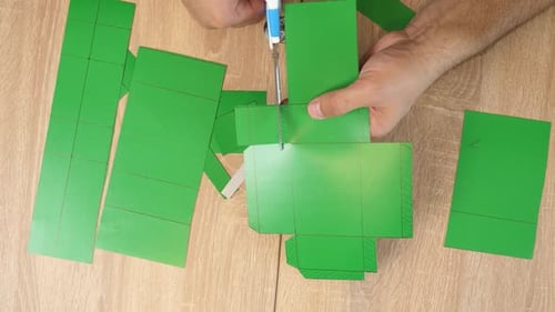 Crafting Cardboard Box Template on Wooden Tabletop
