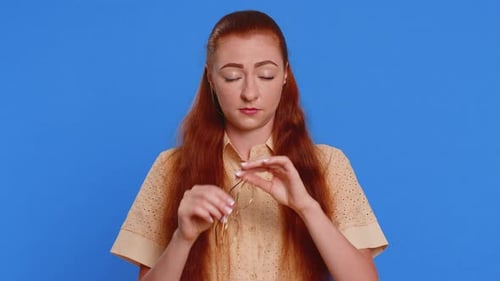 Woman Removing and Cleaning Her Glasses