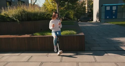 Female with Prosthetic Leg Sitting in City and Using Smartphone Woman with Prosthetic Leg Woman with