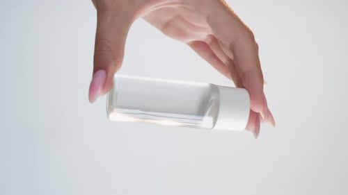 Beauty Product Face Cleansing Hand Mockup Bottle