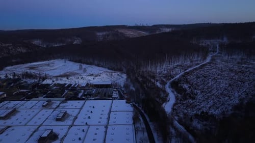 Aerial View of Snow Covered Industrial Area