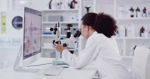 Young Woman Scientist Working in Laboratory