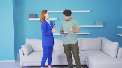 Real Estate Agent Meeting With Client Indoors