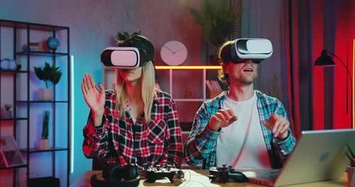Couple Enjoying Virtual Reality Gaming at Home