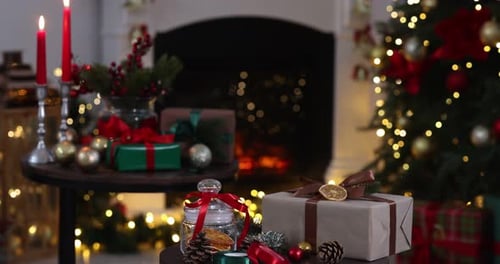 Christmas tree and presents by fireplace festive holiday