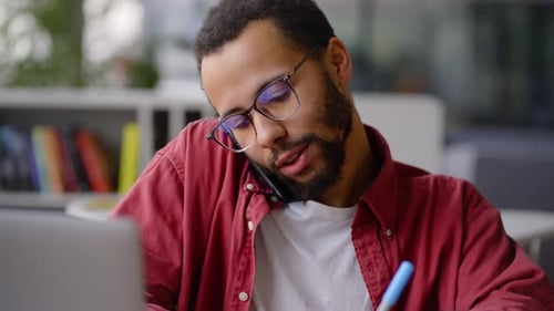 Close Up African American Business Coach Prosperous Teacher Talking on Phone During Online Class