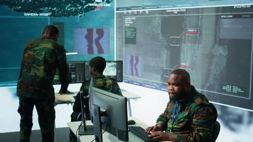 Group of Soldiers in Office Environment Collaborates on Intelligence Analysis