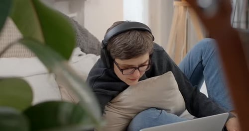 Young Adult Using Laptop Indoors