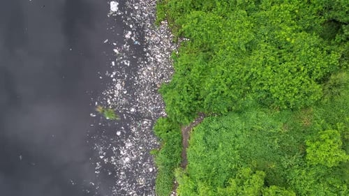 Aerial top down view contamination at dark river