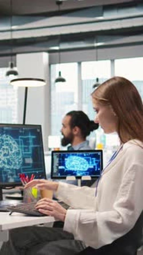 Vertical Video Junior Dev in Office Relies on AI Tech to Run Tasks Across Multiple Devices