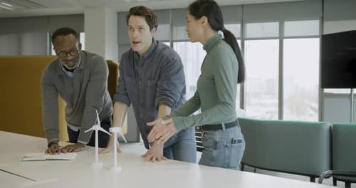 Young Engineer Explaining Green energy Technology in Business Meeting