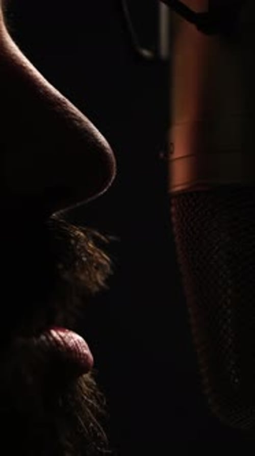 Vertical 4k, Man With Beard Speaking Closely to Studio Microphone, Close Up