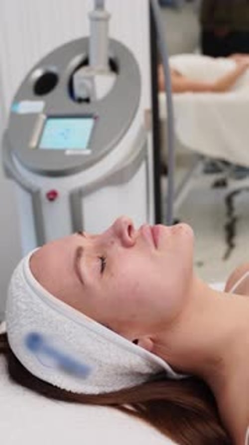Woman Receiving Facial Treatment in Clinic