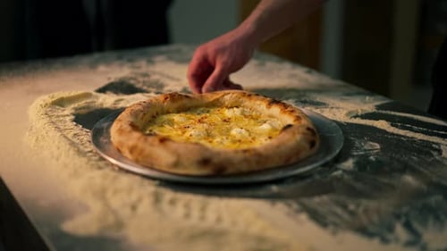 Closeup in Professional Kitchen There is Freshly Prepared Pizza on the Table