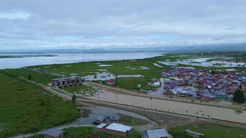 Aerial View of Flooded Village Near Lake
