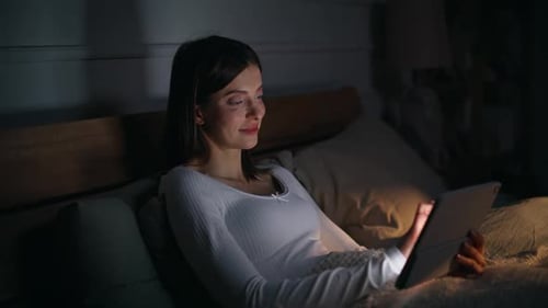 Lady Shopping Online Night Bedroom Touching Glowing Tablet Screen Closeup