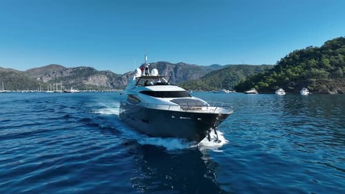 A beautiful and serene scene of a lone yacht on an endless blue sea.
