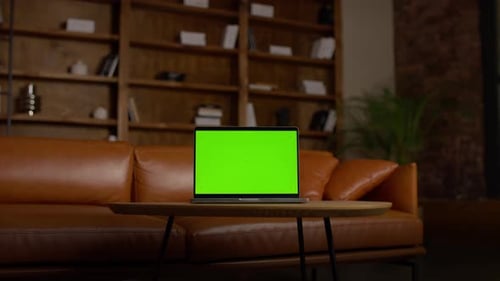 Dollyin Shot of Laptop with Green Screen