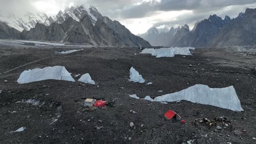 Tents at Goro 2 Campsite surrounded by large chunks of ice along the K2 Base Camp Trek in Pakistan.