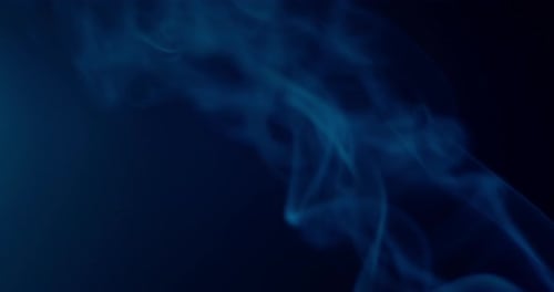 Beautiful swirling colorful smoke on black