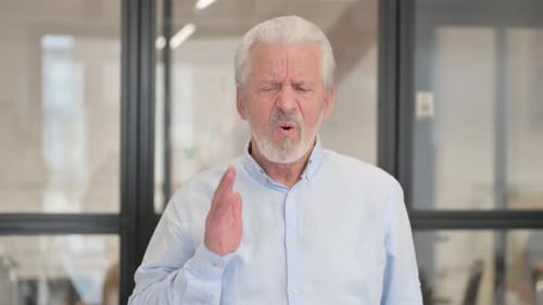 Uncomfortable Senior Old Businessman with Toothache in Office