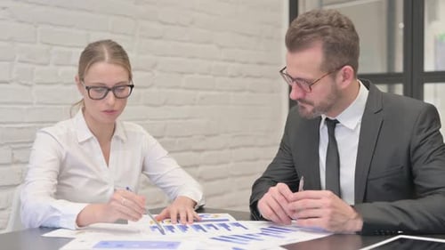 Close Up of Business People Working on Documents