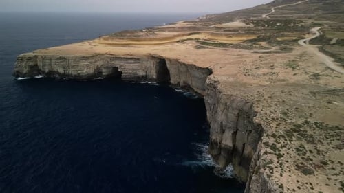 Aerial video over the island of Gozo, beautiful Malta cliffs from above