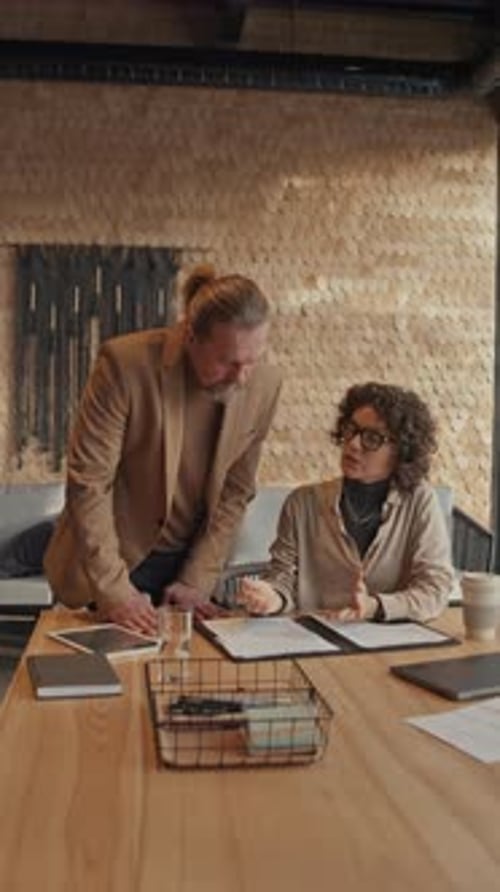 Team Working on Documents at Modern Office Table