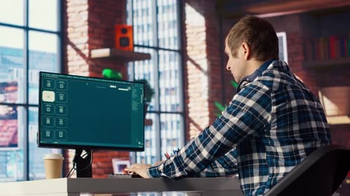 Man Editing Digital Video at Office Computer
