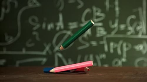 Pencils Fall on the School Desk Filmed on a Highspeed Camera at 1000 Fps