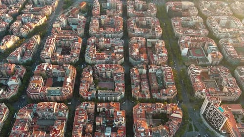 Barcelona city skyline, aerial view. Eixample residential district at sunrise. Catalonia, Spain