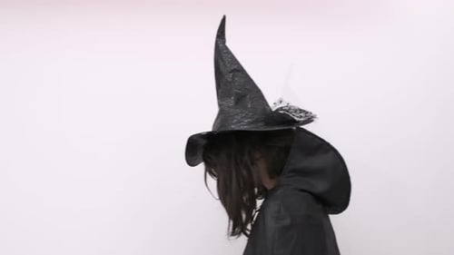 Child in Witch Costume Spinning Around